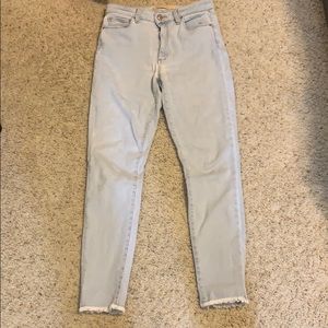 Light wash joes jeans with fringed bottom